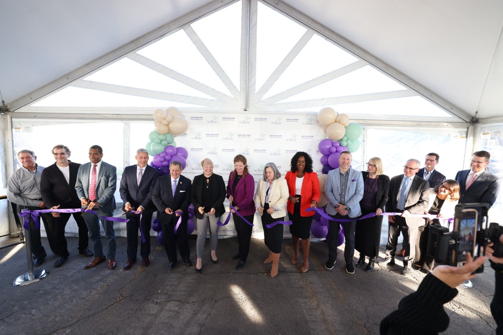 Community leaders and Willow President & CEO, Meaghan de Chateauvieux, cut the ribbon at Willow at Skyview
